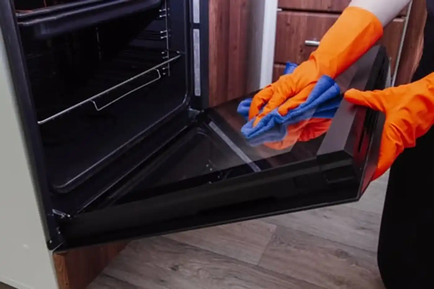 Cleaning the interior glass of an oven door during a deep clean